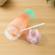 Motivational water bottle showcasing cute printed graphics and gradient finish