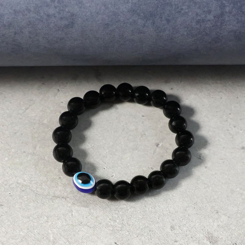 Close-up detail of elegant dual-tone beads on beaded stretch bracelet