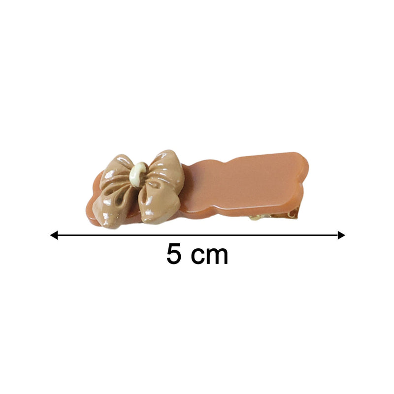 Size comparison image of bow hair clips in solid tones