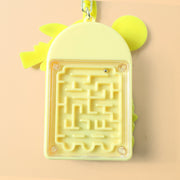 Side view of yellow cartoon character mini calculator keychain with attached bell and ring