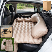 Inflated car air mattress in rear seat for travel comfort