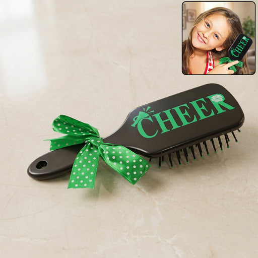 Kids printed hair brush with cute ribbon bow handle, soft bristles for gentle detangling.