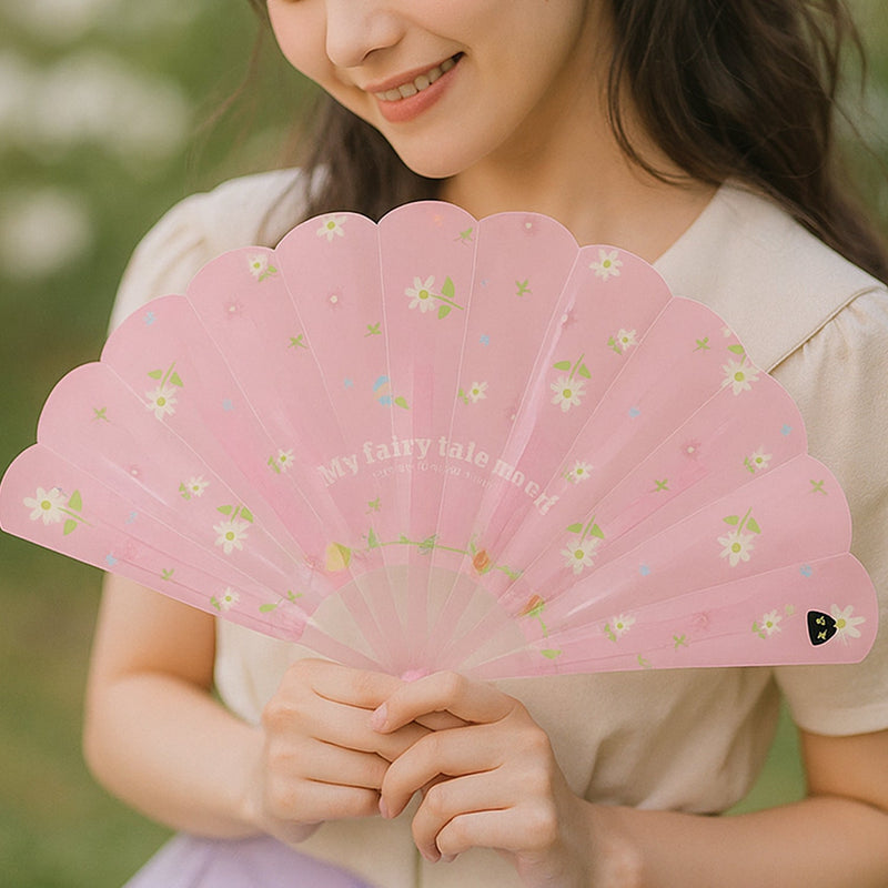 Side profile of floral foldable hand fan revealing design detail