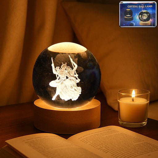 Radha Krishna 3D Crystal Ball Lamp glowing warmly on a bedside table.