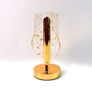 Energy-efficient LED table lamp with crystal-cut shade and golden leaf accents