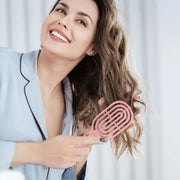 Close-up of flexible bristles on curved vented hair brush for easy detangling