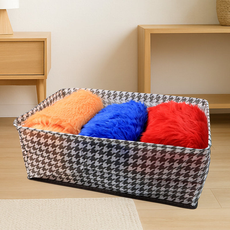 The canvas storage basket neatly folded flat, demonstrating its space-saving design for easy storage.