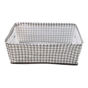 A minimalist-designed foldable canvas storage basket filled with soft linens, enhancing room aesthetics.