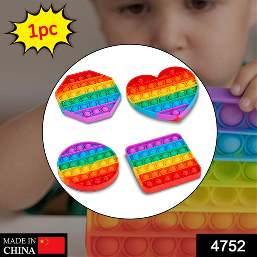 Close up of rainbow colored silicone bubbles on the fidget toy