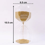 Sand flowing smoothly in glass hourglass timer