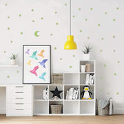Fluorescent star and moon stickers glowing brightly at night, bringing the wonders of the cosmos indoors.
