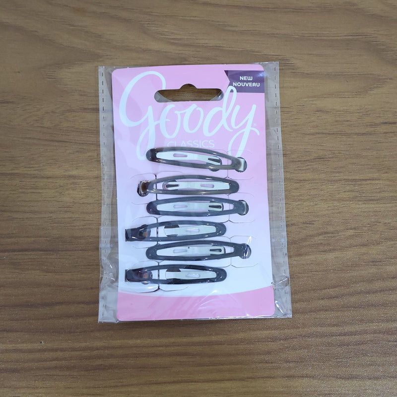 Model wearing snap hair clips styled in wavy hair
