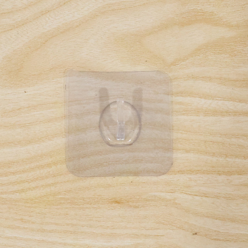 Wall hook on wooden door with transparent adhesive
