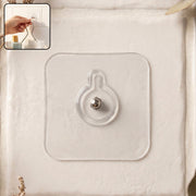 Self-adhesive transparent wall hook with metal stud design