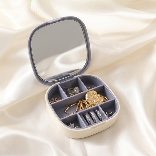 Jewelry storage box with compartments and built-in mirror for organized jewelry