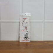 Bal Krishna Makhan Chor keychain attached to vehicle keys adding a spiritual charm