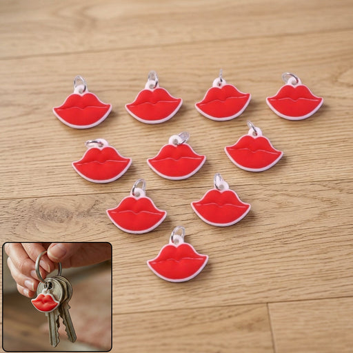 Red lips shape keychain attached to a handbag, stylish accessory