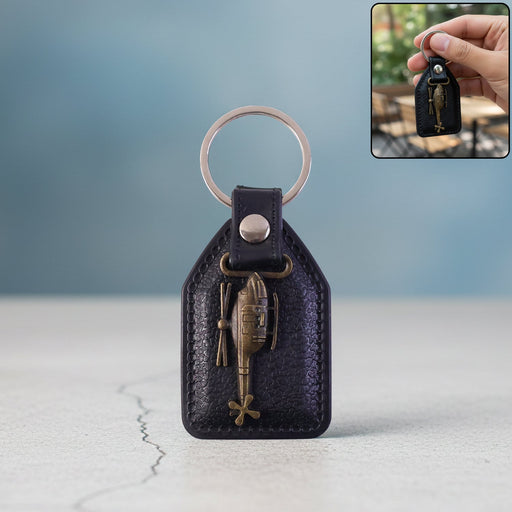Leather finish keychain featuring metal sword emblem front view