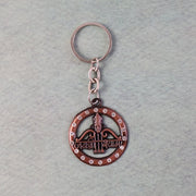 Metal Jai Shree Shyam keychain displaying intricate engraving and crystals
