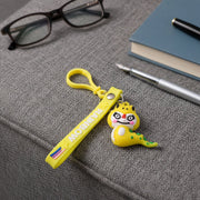 Dinosaur cartoon keychain attached via metal clip to bag zipper