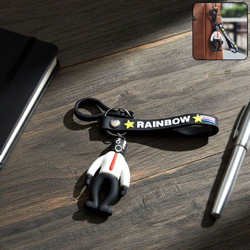 Cartoon man keychain with vibrant rainbow strap attached to keys