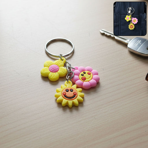 Flower cartoon keychain with colorful triple charm on display