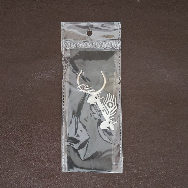 Krishna Flute Keychain displayed in a lifestyle setting, perfect for daily use.