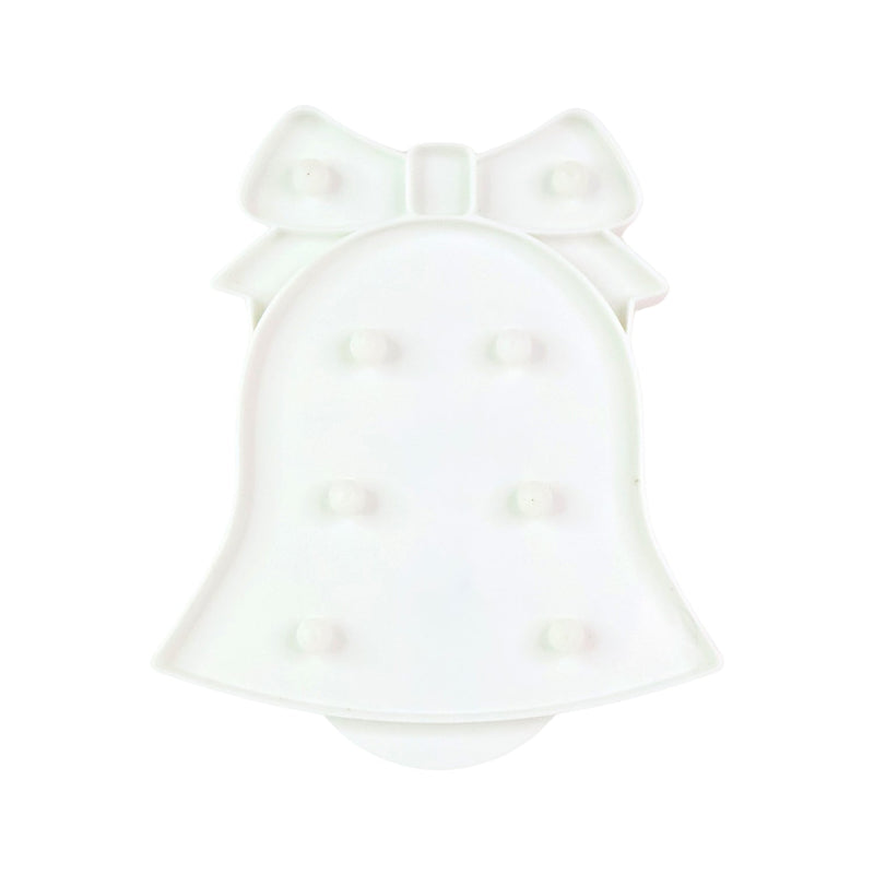 Battery operated LED Bell Shaped Night Light placed on bedside table