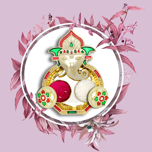 Close-up of the intricately designed plastic Puja Thali with floral details.