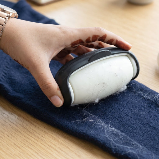 Penguin-shaped eco-friendly lint roller in action