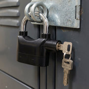 Safora Security Alarm Padlock securing a sturdy metal gate, demonstrating its anti-theft use.