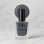 Swatch of long-lasting Calm Grey Matte Nail Polish on skin.