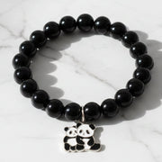 Black beaded stretch bracelet with an adorable panda charm on white background.