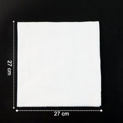 Multicolor tissue paper elegantly folded and used as a disposable table napkin.