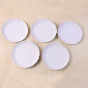 9 inch compostable paper plates arranged for party service