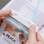 Waterproof mobile pouch featuring adjustable neck strap and peach print pattern