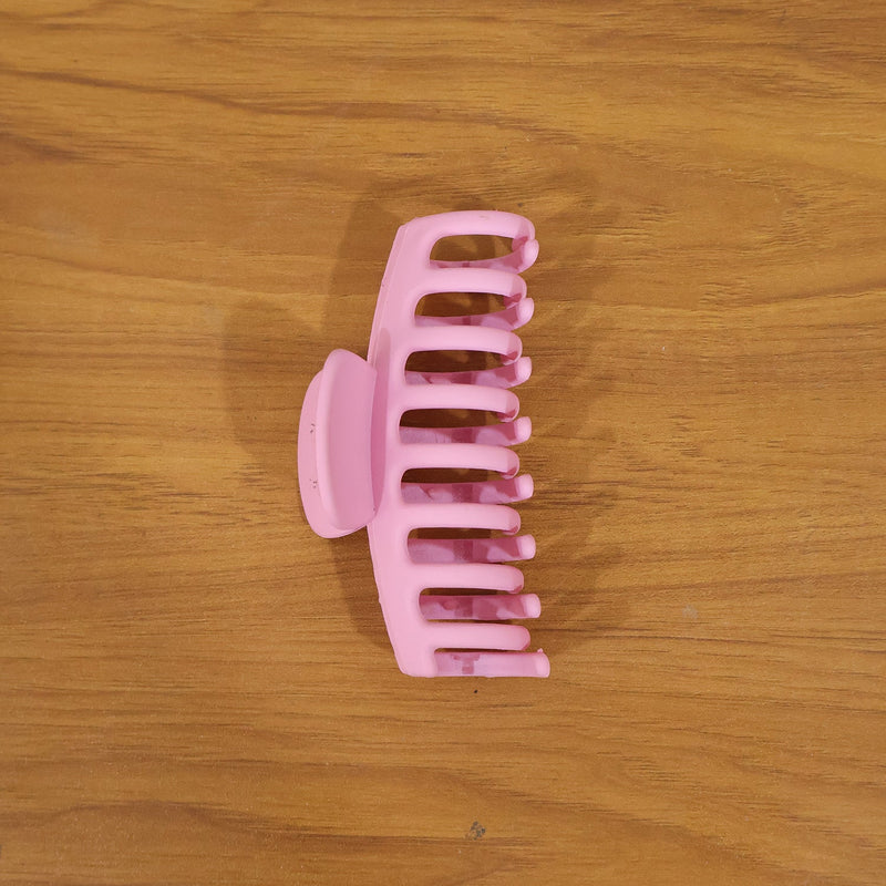 Model wearing elegant pink hair claw clip in styling