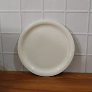 Lightweight and sturdy round serving plate for diverse kitchen needs