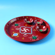 Decorative pooja thali with Ganesha motif used during an Indian religious ceremony