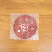 Live use photo of hand-painted Ganesha pooja thali with lit diyas during ritual