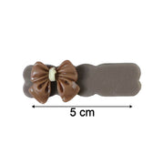 Size reference image showing length of bow hair clips measuring 14 cm