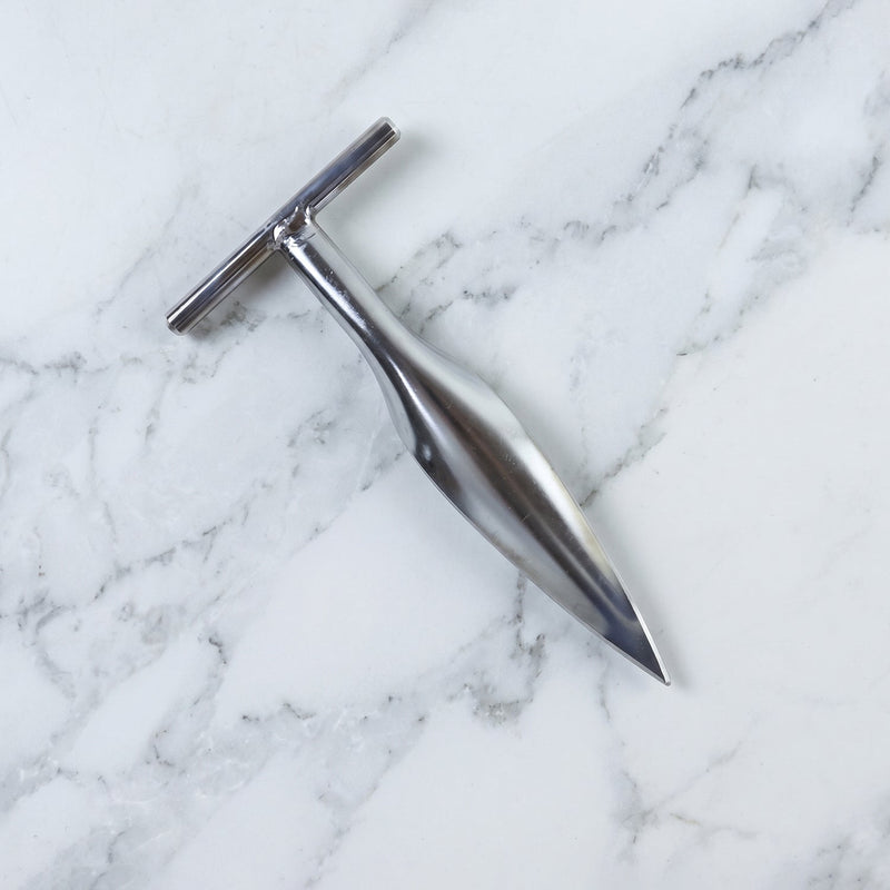 Stainless steel coconut breaker tool set displayed on a white background