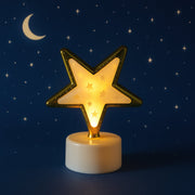 Multiple Star Shaped Flameless LED Candles creating a cozy ambience.