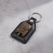 Military tank design keychain attached to bunch of keys with robust metal ring