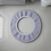 Stretchable toilet seat cover shown separately for demonstration