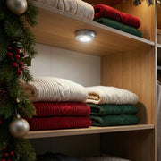 LED tap light providing bright illumination for a kitchen cabinet.