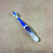 Children’s toothbrush with soft bristles and colorful cartoon design