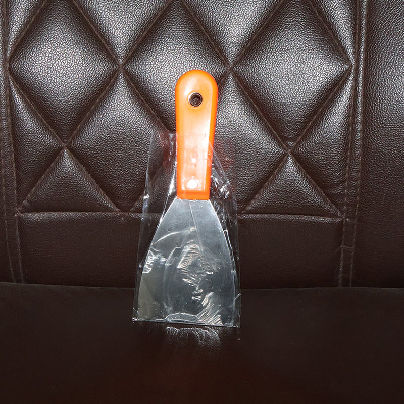 Putty knife with a comfortable soft rubber handle and a hanging hole for easy storage.