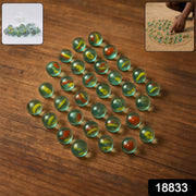 Set of assorted glass marbles for kids featuring traditional kancha game colors and designs
