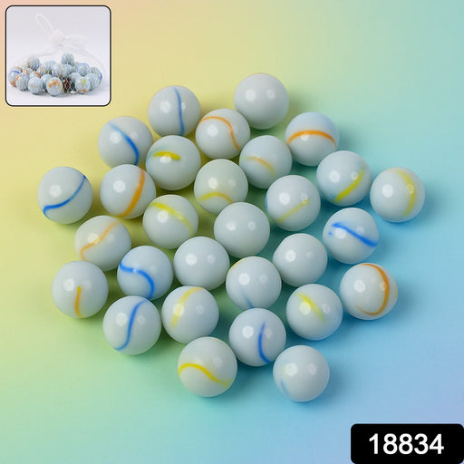 Net pouch containing classic white glass marbles with colorful swirls